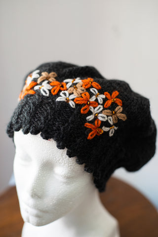 Black beret with embellished flowers