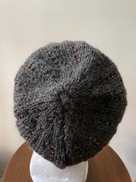 Knitted beanie in gray with copper seed beads