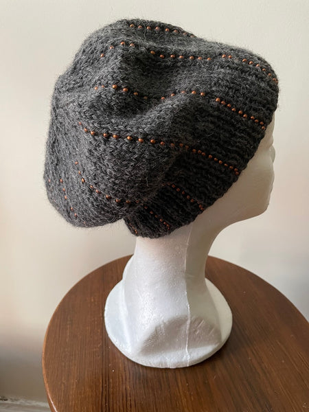 Knitted beanie in gray with copper seed beads