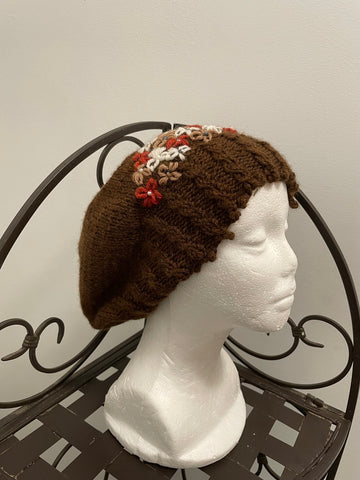 Brown beret with embellished flowers