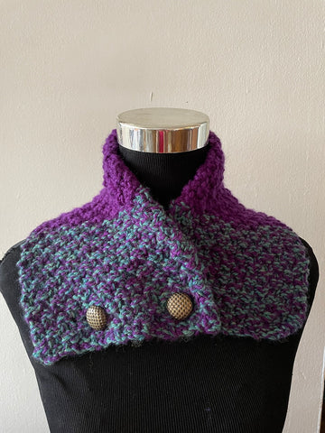 Knitted cowl in green and purple wool